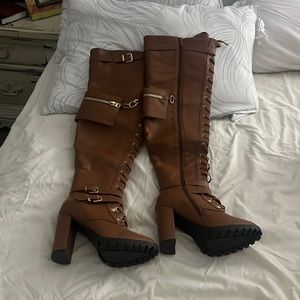 Lace up knee high heeled boots